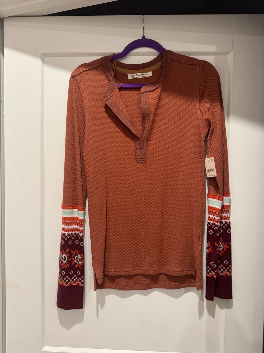 Free People long sleeve top. Size large. NWTs.